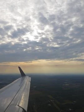 Tranquil Beautiful View From Plane Window at Blue Sky over White Clouds with  Stock Photos