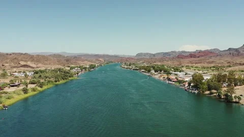 Tranquil Blue River Surrounded By Brown Desert Landscape Stock-Footage 209294124