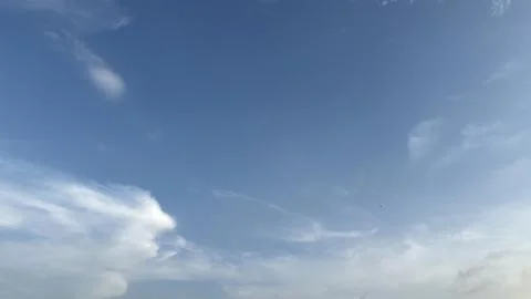 A tranquil blue sky with wispy white clouds during daylight hours Stock Photos