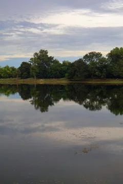 Tranquil Calm Waters and Mirror Reflection at Srah Srang Ancient Royal Reservoir Stock Photos