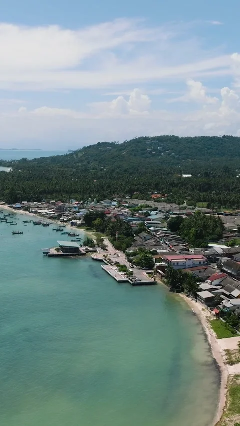 Tranquil coastal view with turquoise waters and lush hills. Ko Samui, Thailand. Stock Footage 302128763