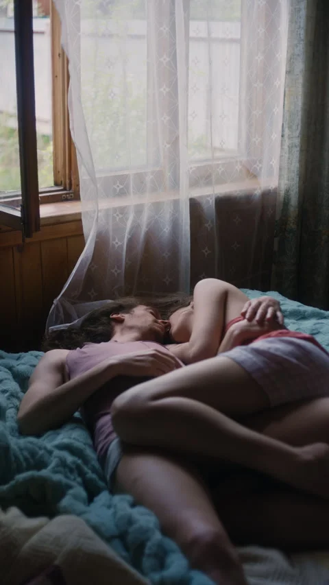 Tranquil Couple Sleeping Under Fluttering Sheer Curtain Video stock 312207459