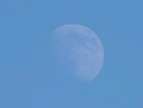 Tranquil Daytime Moon Casting Gentle Light Across Bright Azure Sky With Subtle Stock Photos