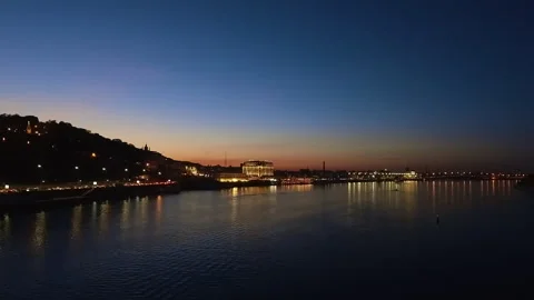 Tranquil Evening Cityscape Over Dnieper River with Golden Sunset Reflections Stock Footage 306661187