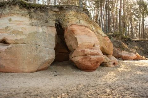Tranquil Forest Landscape with Eroded Rock Formations. Veczemju cliffs, Latvi 스톡 사진