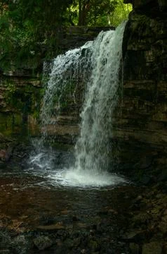Tranquil Forest Waterfall Cascading Over Mossy Rock Cliff Stock Photos