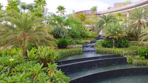 Tranquil garden scene featuring cascading water steps surrounded Stock Footage 302370806