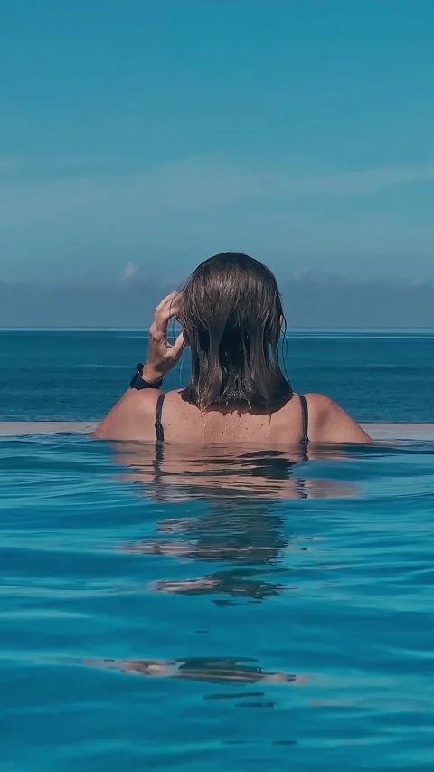 Tranquil Girl Glides Gracefully Towards Distant Horizon Beneath Water Outlines Video stock 332013553