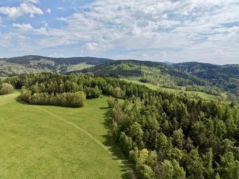 Tranquil Hillside Landscape Showcasing Twisting Pathways Surrounded By Tree.. Stock Photos