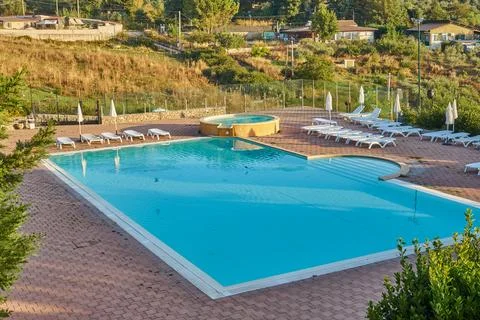 Tranquil hillside pool terrace with turquoise water and panoramic countrysi.. Stock Photos