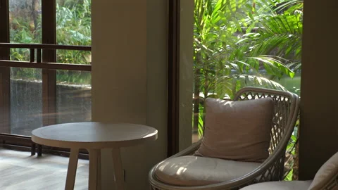 Tranquil indoor relaxation corner with comfortable armchair and side Stock Footage 276180858
