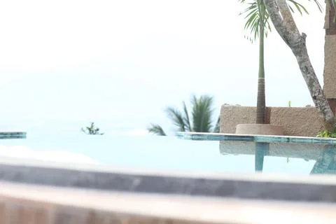 Tranquil Infinity Pool Overlooking Serene Ocean Vista Stock Photos