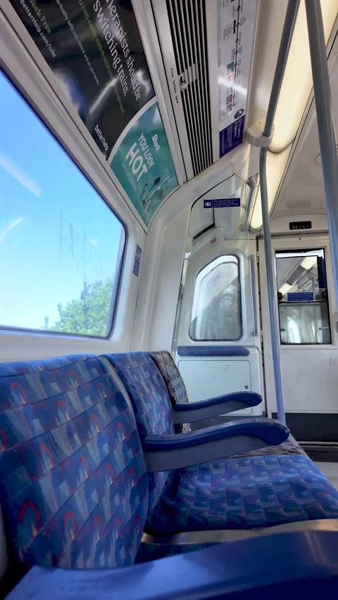 Tranquil interior of a vacant Jubilee Line train carriage on the London Stock Footage 337874040