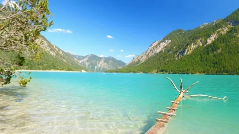 Tranquil Lake in the Austrian Alps Surrounded by Wild Mountain Nature  Discov Stock Footage 308649452