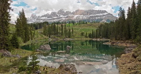 Tranquil Lake of Carezza in the Dolomite Alps is a peaceful retreat Stock Footage 280205508