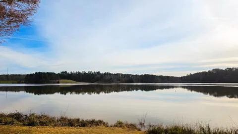 Tranquil Lake with Forest Reflections Stock Photos