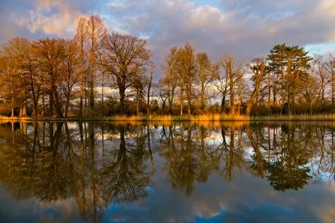 Tranquil Lake Reflection at Sunset Stock Photos