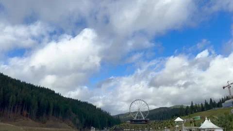 Tranquil lake with stunning view of forest and ferris wheel Stock Footage 280697898
