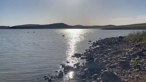 Tranquil Lake with Sunrays Reflected Stock-Footage 154214552