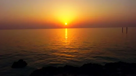 Of a tranquil lake at sunset with gentle waves creating, stock footage. Stock Footage 304818206