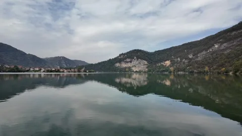Tranquil Lake Surrounded by Mountains Stock Footage 289445642