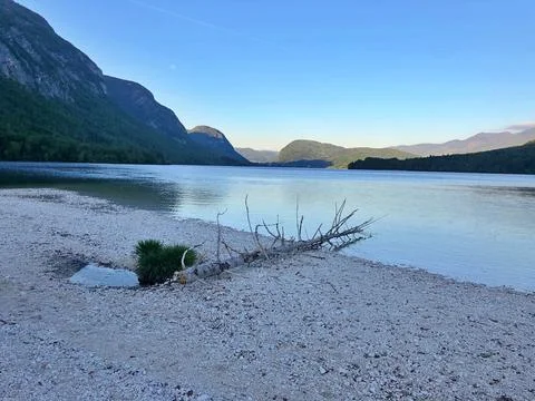 Tranquil Lakeside View With Mountain Backdrop at Late Afternoon in Nature Stock Photos