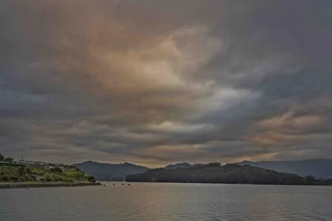 Tranquil Landscape with Dramatic Clouds Stock Photos