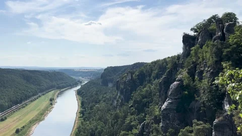 Tranquil landscape on the Elbe River surrounded by lush green hills Stock Footage 303896736