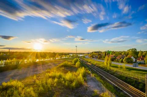 A tranquil landscape view of cloud movement during the evening with golden su Stock Photos