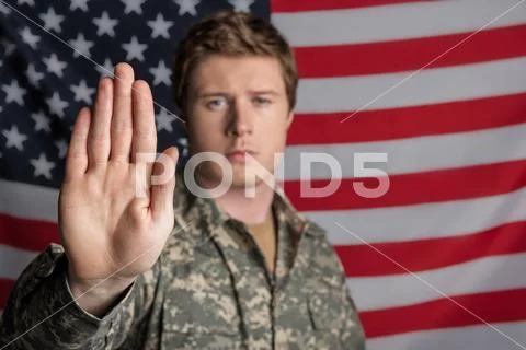 Tranquil male soldier is proud of his country Stock Photos