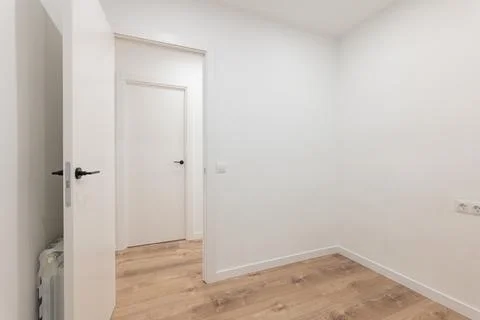 Tranquil minimalist empty room with open doors and wooden flooring, modern clean Фото