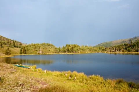 Tranquil mountain lake with reflections Stock Photos