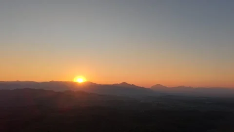 Tranquil Mountain Landscape in Warm Sunset Glow Stock Footage 326176708