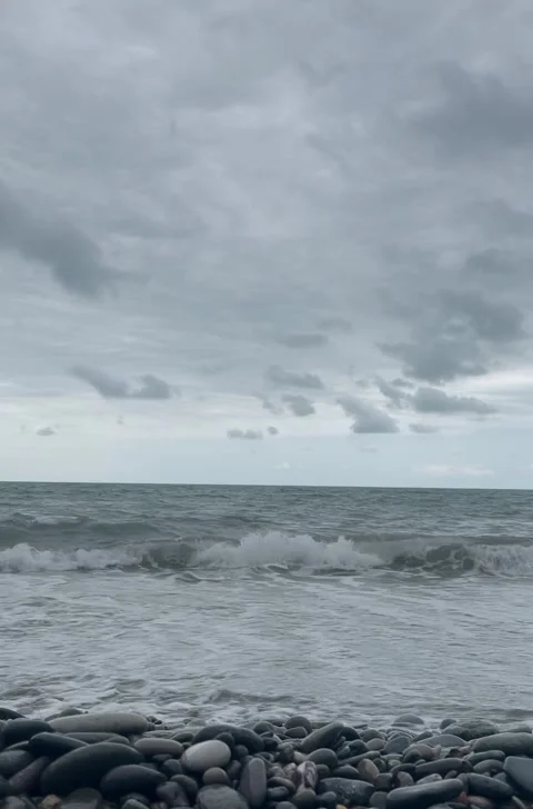 Tranquil Ocean Ripples on Rocky Beach Stock Footage 304884125