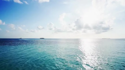 Tranquil Ocean Scene: Azure Waters and Bright Sunlight Stock Footage 309287356