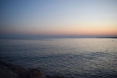 Tranquil Ocean Sunset with Distant Horizon Stock Photos