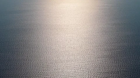 Tranquil Ocean Surface with Sunlight Reflection on Calm Water Horizon Stock-Footage 337999260