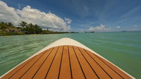 A tranquil ocean view with a charming boat gently floating Stock Footage 313822153