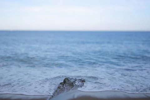 Tranquil Ocean Waves and Clear Sky Stock Photos