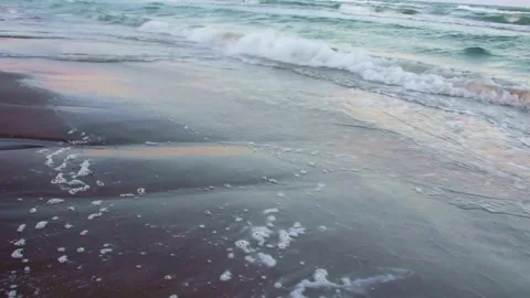 Tranquil Ocean Waves Receding on Sandy Beach at Dawn Stock Footage 311654243