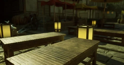 Tranquil outdoor dining area featuring wooden tables and soft lighting Stock Footage 327257778