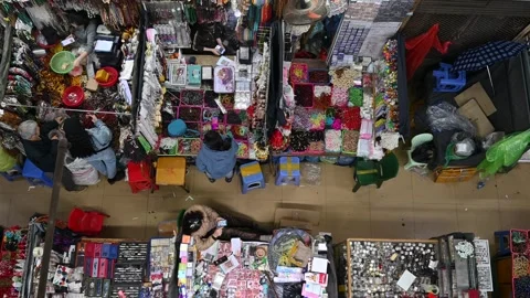 A Tranquil Overhead View of the Bustling Stalls at Dong Xuan Market Stock Footage 302841389