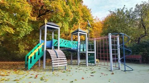 Tranquil Park Playground Surrounded by Fall Colors Stock Photos