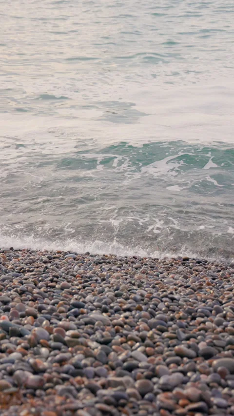 Tranquil Pebble Beach with Gentle Ocean Waves at Silence Beach, Asturias, Spain Stock Footage 302296696