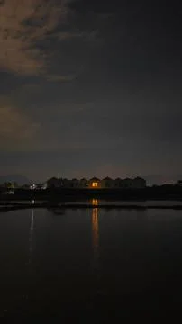 Tranquil Reflection of House at Night Фото