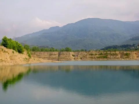 Tranquil reflections on a serene pond, capturing peace and nature's harmony. Stock Photos