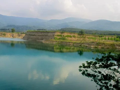 Tranquil reflections on a serene pond, capturing peace and nature's harmony. Stock Photos