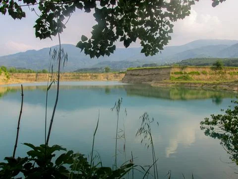 Tranquil reflections on a serene pond, capturing peace and nature's harmony. Stock Photos