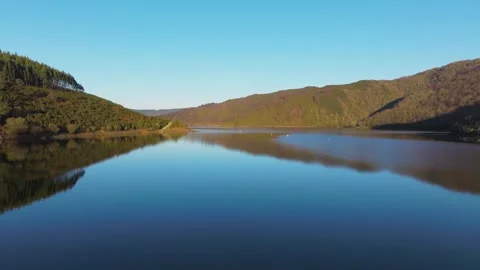 Tranquil River And Surrounding Mountains 動画素材 262334023