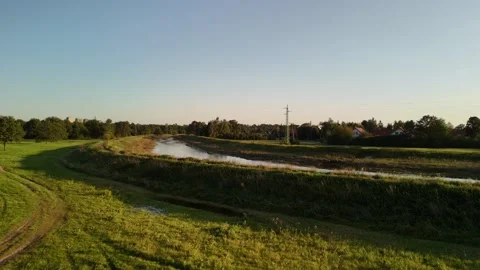 Tranquil River with Green Fields and Trees Video stock 291132178